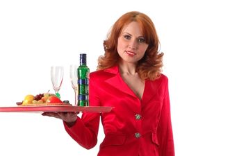 Waitresses Dressed in Red Rake in The Cash From Male Diners