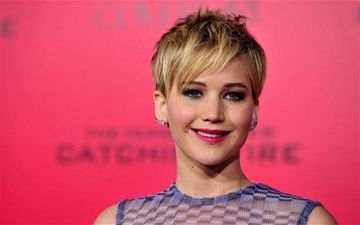 Chris Martin ‘Sweeping Jennifer Lawrence Off Her Feet’ With Love Songs