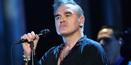 WATCH: Morrissey Escorted Away By Security As Fans Invade The Stage