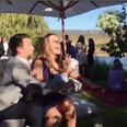WATCH: This Man Does NOT Want His Girlfriend To Catch The Wedding Bouquet