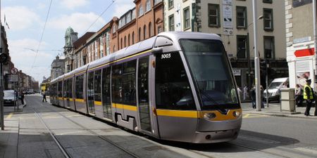A tour bus has crashed into the Luas in Dublin City centre