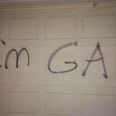 PIC: These Parents Had The BEST Response To The Homophobic Vandals Who Graffitied Their House