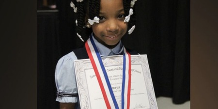 A 7-year-old born without hands has won a national handwriting competition