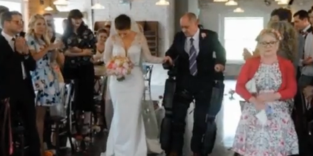 Paralysed father uses robotic suit to walk daughter down the aisle