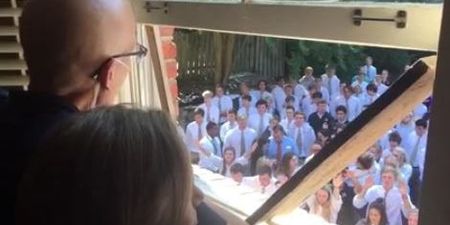 Hundreds of students gather outside ill teacher’s house to sing to him