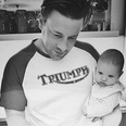 Picture of Jamie Oliver holding son River Rocket sparks a safety debate