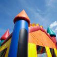 A six-year-old has died, and six others were injured, after a bouncing castle exploded