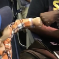Adorable toddler fist bumping his way onto a flight will brighten your day
