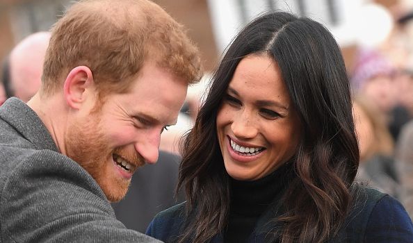 Meghan and Harry couldn't keep their hands off each other on Bondi Beach