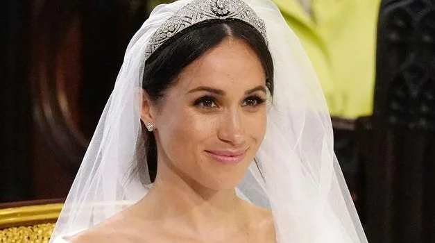 We have a clip of Meghan Markle reacting to her wedding dress and she's predictably adorable
