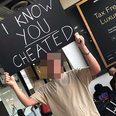 Man waits at airport with ‘I know you cheated’ sign for partner and holy mother of God