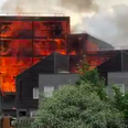 A hundred firefighters are battling a massive fire at block of flats in east London