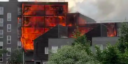 A hundred firefighters are battling a massive fire at block of flats in east London