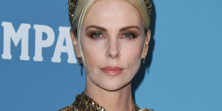 Charlize Theron looked like a golden goddess at last night’s Costume Designers Guild Awards