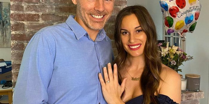 Des Bishop and Hannah Berner pose with engagement ring
