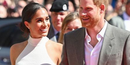 Prince Harry and Meghan look happier than ever in rare public appearance