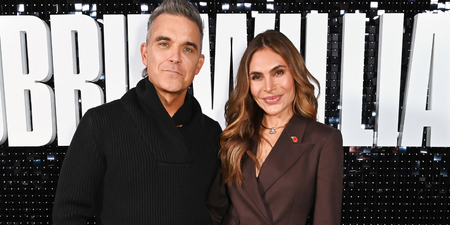 Robbie Williams embraces dad duty as he struggles with Christmas tree star