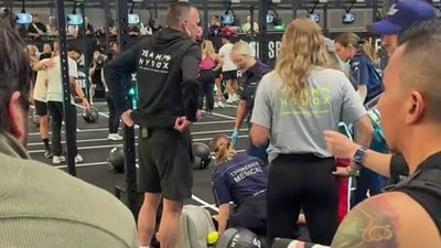Hyrox athlete completes race while girlfriend is treated by paramedics